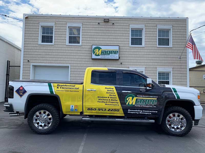 The main office of Magee Property Management with one of their work pickup trucks in front of the office